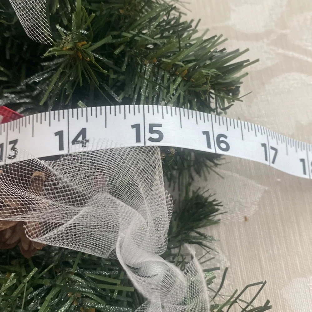 Winter holiday wreath with ho ho ho & BELIEVE adornments evergreen base